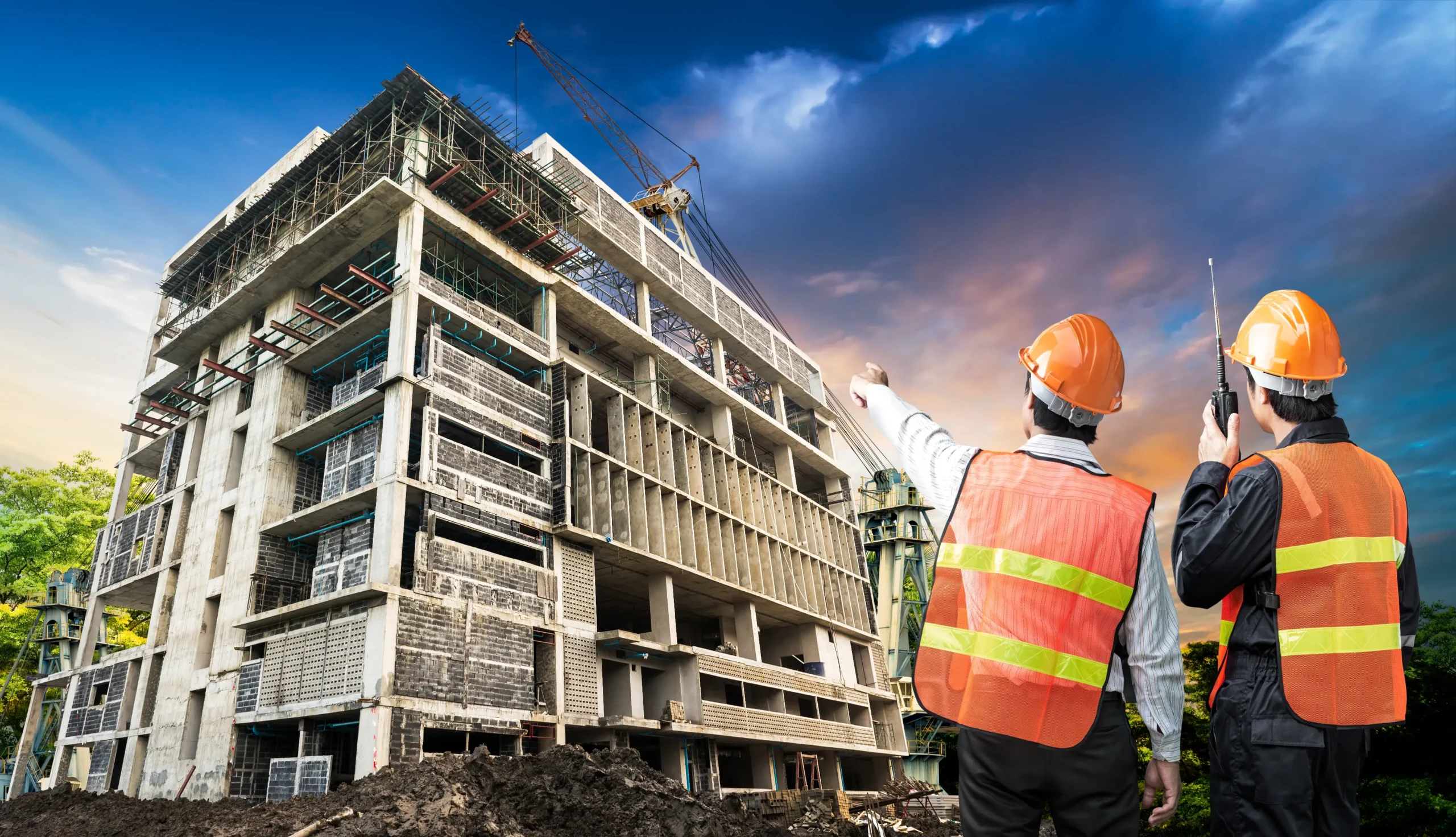 "Construction site with workers overseeing building progress"