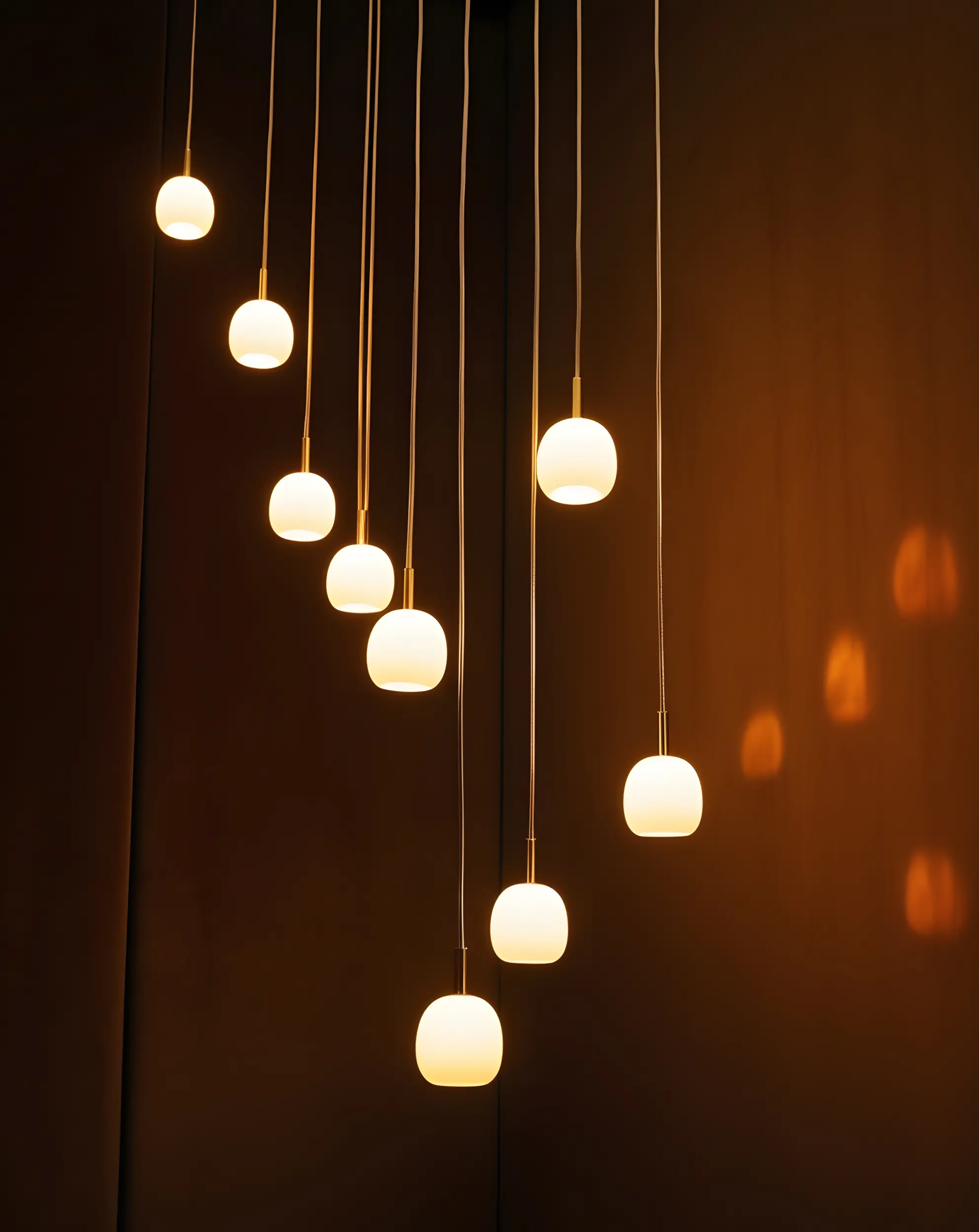 modern-pendant-lights-warm-glowing-spherical-glass-fixtures-hanging-arrangement